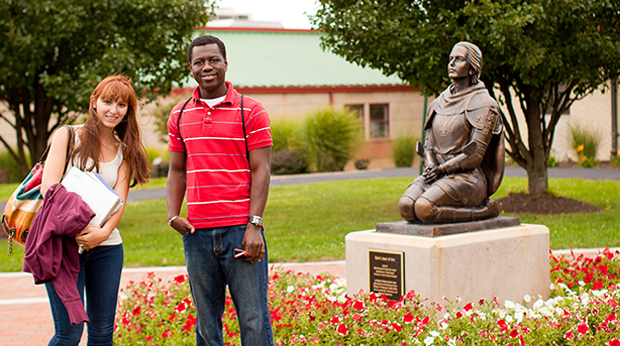 Two La Roche students outside of Wright Library