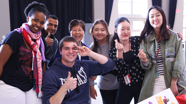 La Roche international group of students pictured at a table in Campus Center Square.